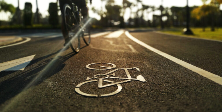Cyclist,Are,Cycling,A,Bike,On,Bicycle,Bike,Lane,In
