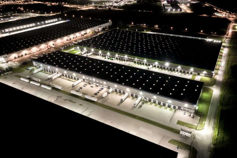 Night,Aerial,View,Of,Goods,Warehouse.,Logistics,Center,In,Industrial
