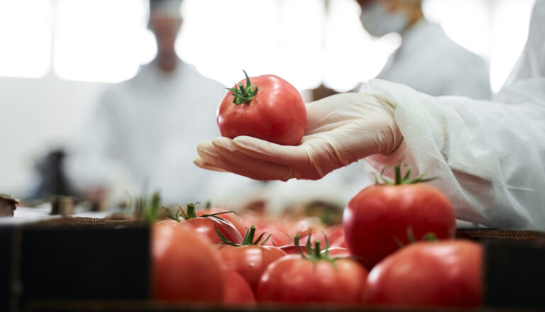 Cropped,Photo,Of,A,Supermarket,Worker,Demonstrating,The,Fresh,Produce