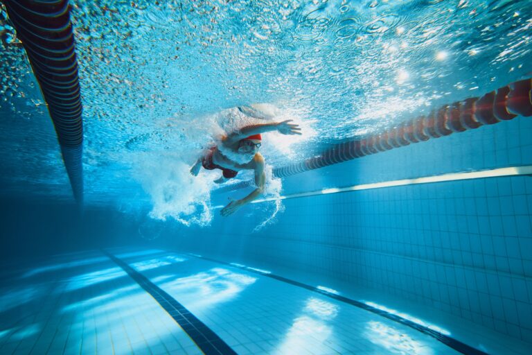 Dynamic,Image,Of,Young,Man,,Swimmer,In,Motion,,Swimming,Freestyle